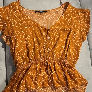 orange/tan poca dots top with buttons